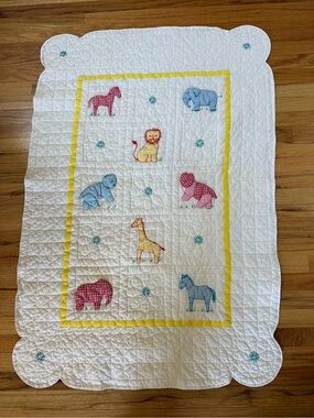 Baby quilt highlighting gingham animals….made by hand.  NWOT.